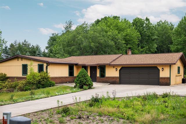 front view picture of 6239 Lancaster Lane, Cadillac, MI. 49601