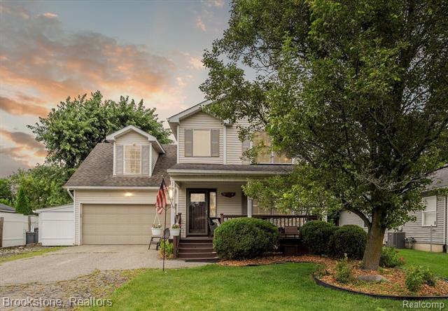 front view picture of 9297 6 Mile Road, Northville, MI. 48168