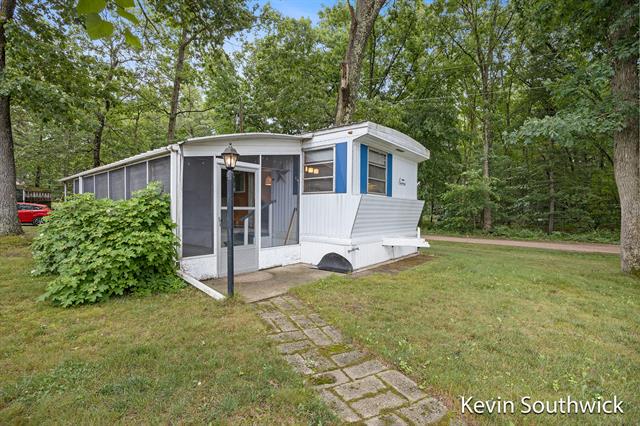 front view picture of 8176 W Pine Gove Beach Drive, Baldwin, MI. 49304