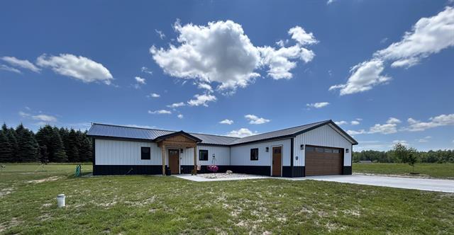 front view picture of 635 Sw Grouse Drive, Kalkaska, MI. 49646