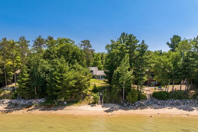 front view picture of 339 N Golden Beach Drive, Kewadin, MI. 49648