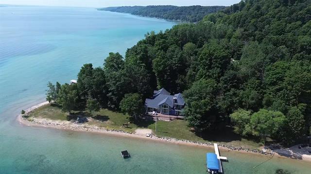 front view picture of 3485 Nw Torch Lake Drive, Kewadin, MI. 49648