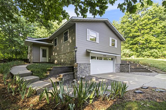 front view picture of 8339 Childsdale Avenue Ne, Rockford, MI. 49341