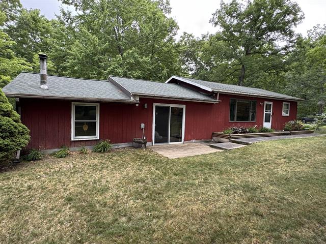 front view picture of 4392 W 9 Mile Road, Irons, MI. 49644