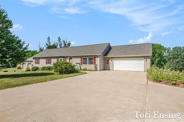 front view picture of 12345 Morgan Mills Road Ne, Greenville, MI. 48838
