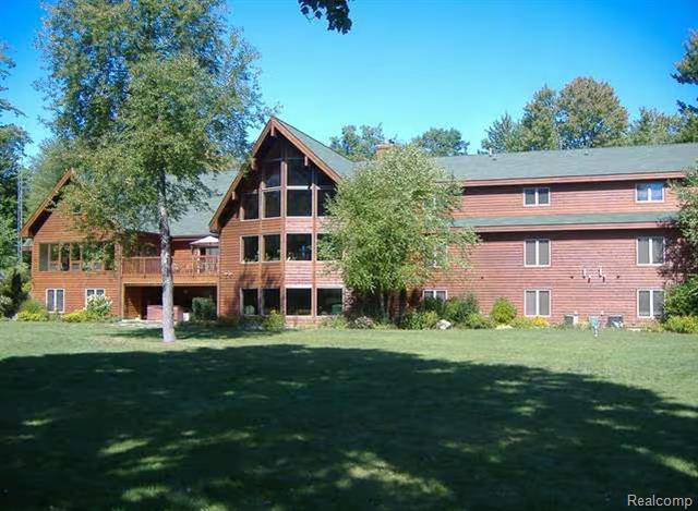 front view picture of 355 W Mannsiding Road, Harrison, MI. 48625