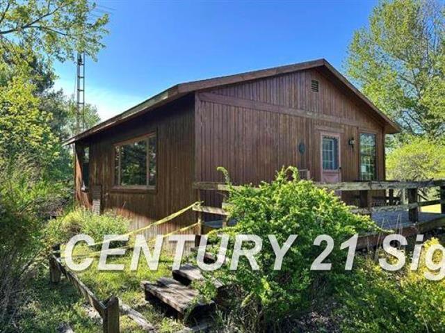 front view picture of 605 N Poor Farm Road, Harrisville, MI. 48740