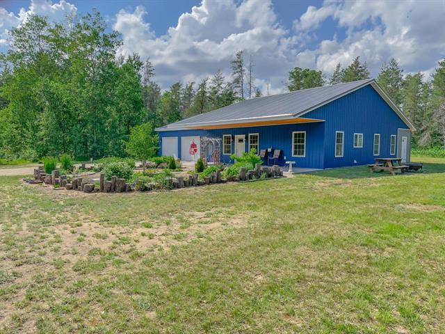 front view picture of 5670 N Harrison Avenue, Harrison, MI. 48625