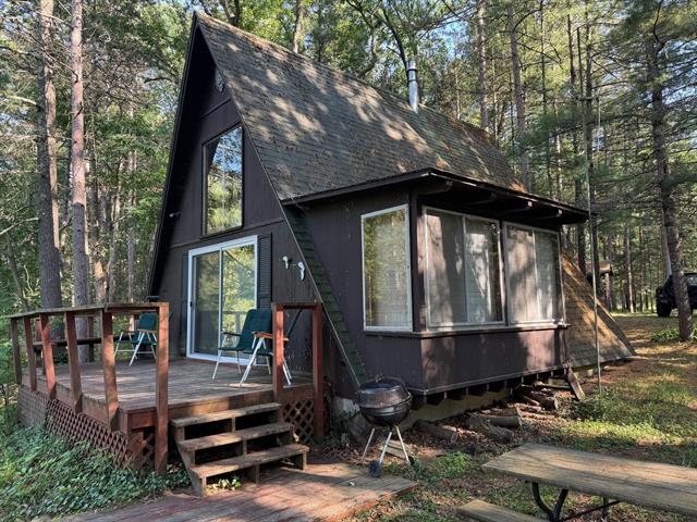 front view picture of 8160 W River Road, Irons, MI. 49644