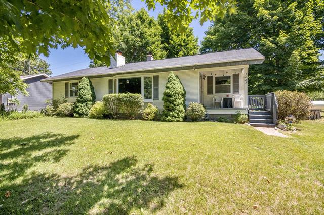 front view picture of 7023 Meadow Brooke Lane, Kewadin, MI. 49648