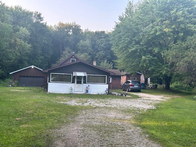 front view picture of 10425 3 Mile Road, East Leroy, MI. 49051
