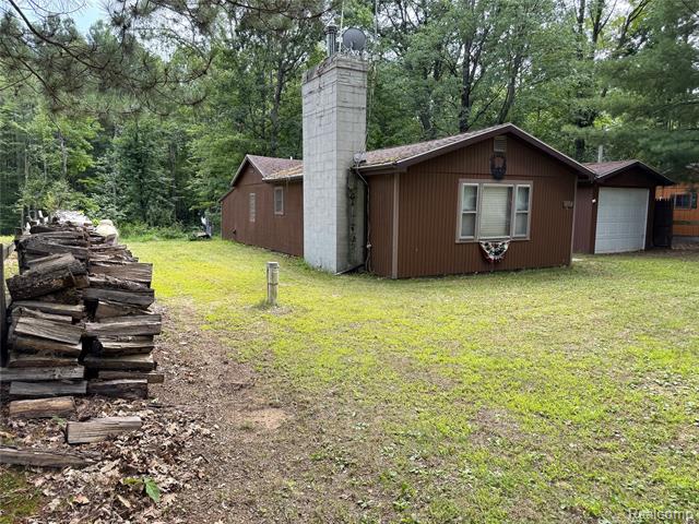 front view picture of 5309 Rose Street, Gladwin, MI. 48624