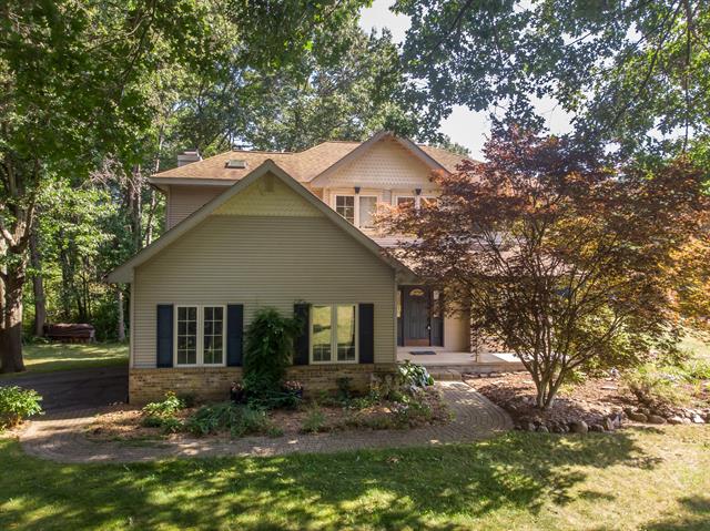 front view picture of 9866 Huron Creek Drive, Dexter, MI. 48130
