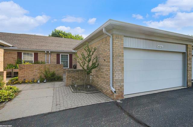 front view picture of 48702 Sturgis Court, Utica, MI. 48315