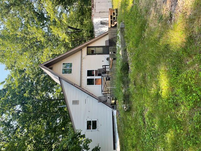 front view picture of 10897 N Mac Road, Irons, MI. 49644