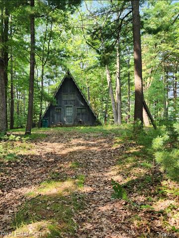 front view picture of 1029 Springwood Drive, Prudenville, MI. 48651