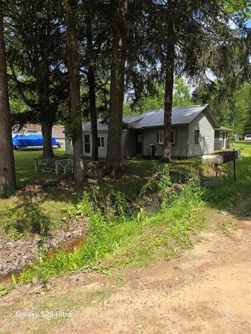 front view picture of 485 Bushong Beach Drive, Gladwin, MI. 48624