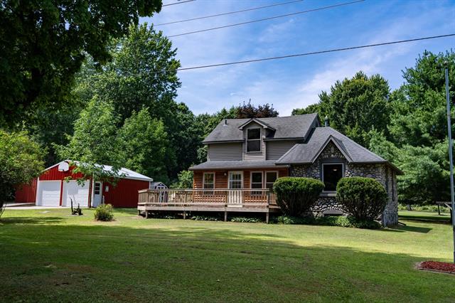 front view picture of 731 N Rolland Road, Weidman, MI. 48893