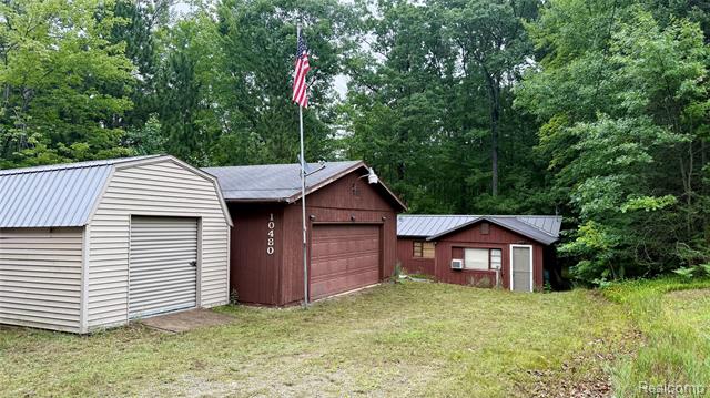front view picture of 10480 N Athey Avenue, Harrison, MI. 48625