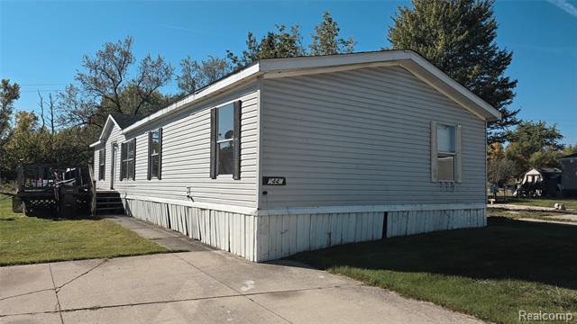 front view picture of 5445 Americana Lane, Casco, MI. 48064