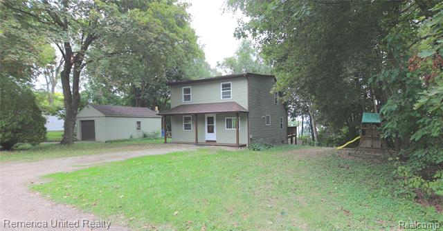 front view picture of 10324 Greenwood Road, Whitmore Lake, MI. 48189
