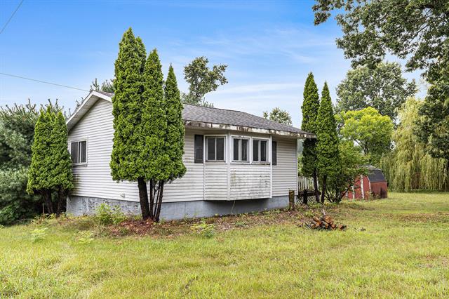 front view picture of 4009 W Long Lake Road, Orleans, MI. 48865