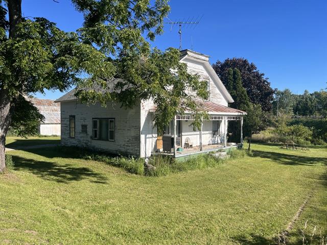 front view picture of 8789 Derby Road, Six Lakes, MI. 48886