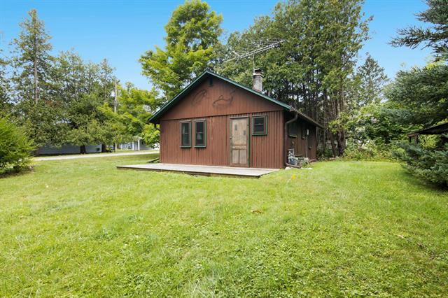 front view picture of 7758 Maple Street, Central Lake, MI. 49622
