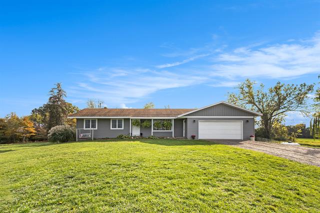 front view picture of 8470 Garfield Street, Coopersville, MI. 49404