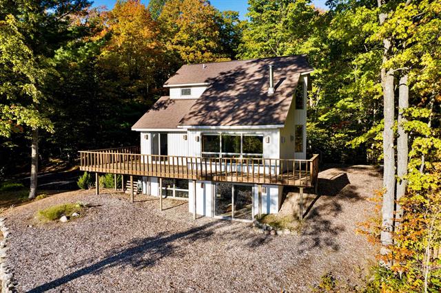 front view picture of 6441 Wind Ridge Lane, Bellaire, MI. 49615