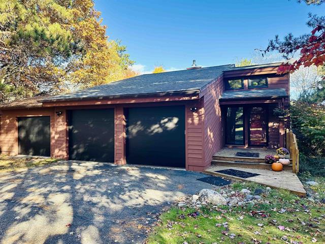 front view picture of 11212 Fairway Drive, Roscommon, MI. 48653