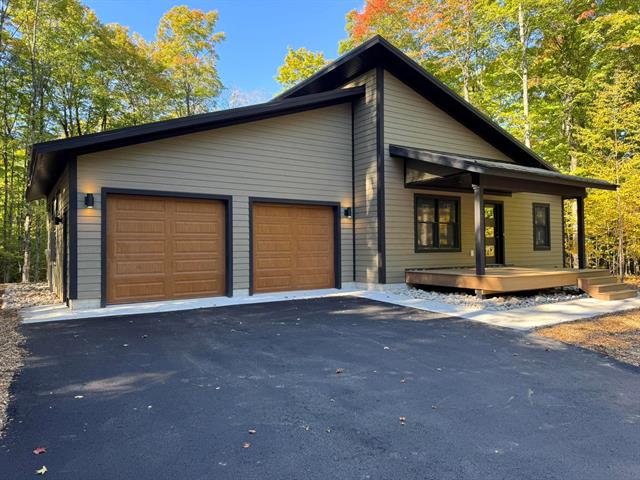 front view picture of 2418 Hawks Eye Drive, Bellaire, MI. 49615