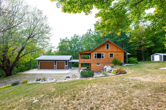 front view picture of 4993 Co Road 571, Kalkaska, MI. 49646