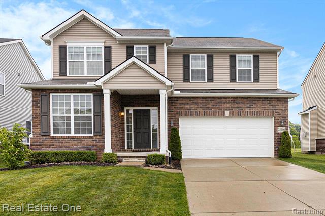 front view picture of 28406 Oakmonte Cir E, New Hudson, MI. 48165