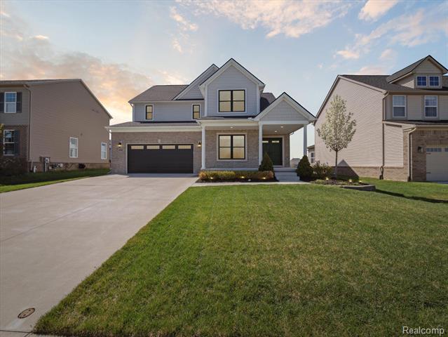 front view picture of 900 N Mill St, South Lyon, MI. 48178