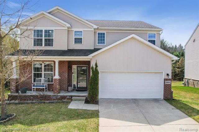 front view picture of 59685 Twin Pines Dr, New Hudson, MI. 48165