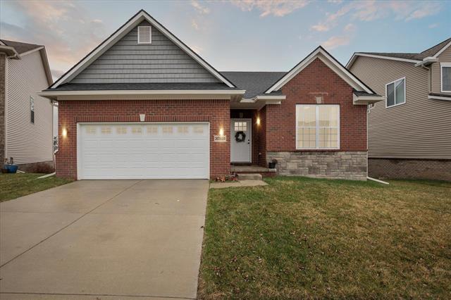 front view picture of 30909 Asbury Hill Ct, New Hudson, MI. 48165