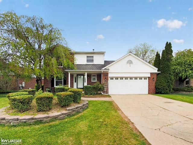 front view picture of 46027 Tally Ho Dr, Macomb, MI. 48044
