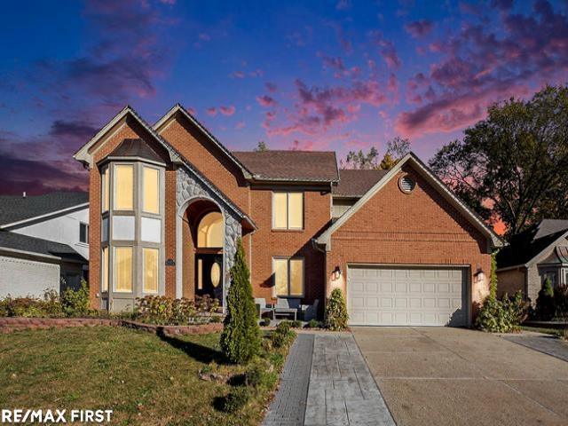 front view picture of 18765 Riverside Glen, Macomb, MI. 48044