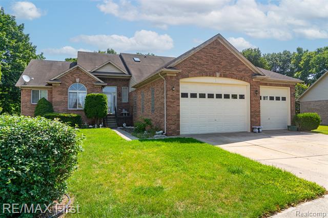front view picture of 46466 Serenity Dr, Macomb, MI. 48044