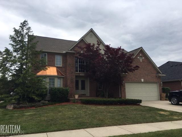 front view picture of 46681 Covington Dr, Macomb, MI. 48044