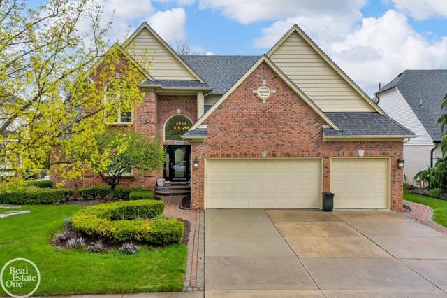 front view picture of 47206 Woodberry Estates Dr, Macomb, MI. 48044