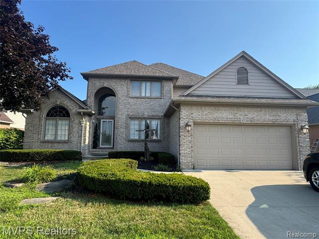 front view picture of 47033 Woodberry Estates Dr, Macomb, MI. 48044