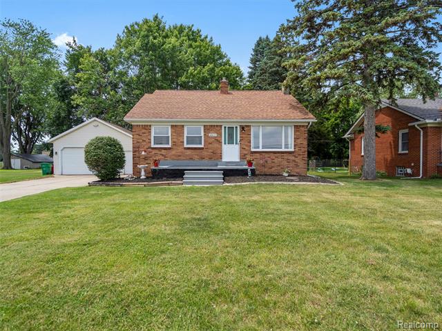 front view picture of 48425 Romeo Plank Rd, Macomb, MI. 48044