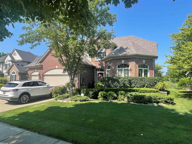 front view picture of 48199 Village Dr, Macomb, MI. 48044