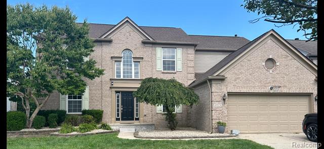 front view picture of 49576 Dunhill Dr, Macomb, MI. 48044
