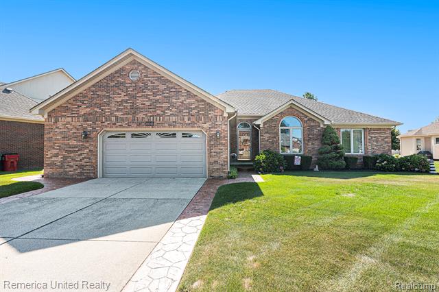 front view picture of 49345 Dunhill Dr, Macomb, MI. 48044