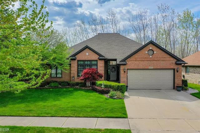 front view picture of 51077 Woodside Dr, Macomb, MI. 48042