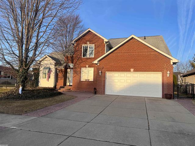 front view picture of 51077 Blue Spruce Dr, Macomb, MI. 48042