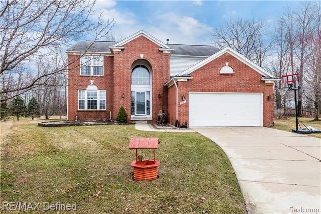 front view picture of 18124 Bayside Dr, Macomb, MI. 48042